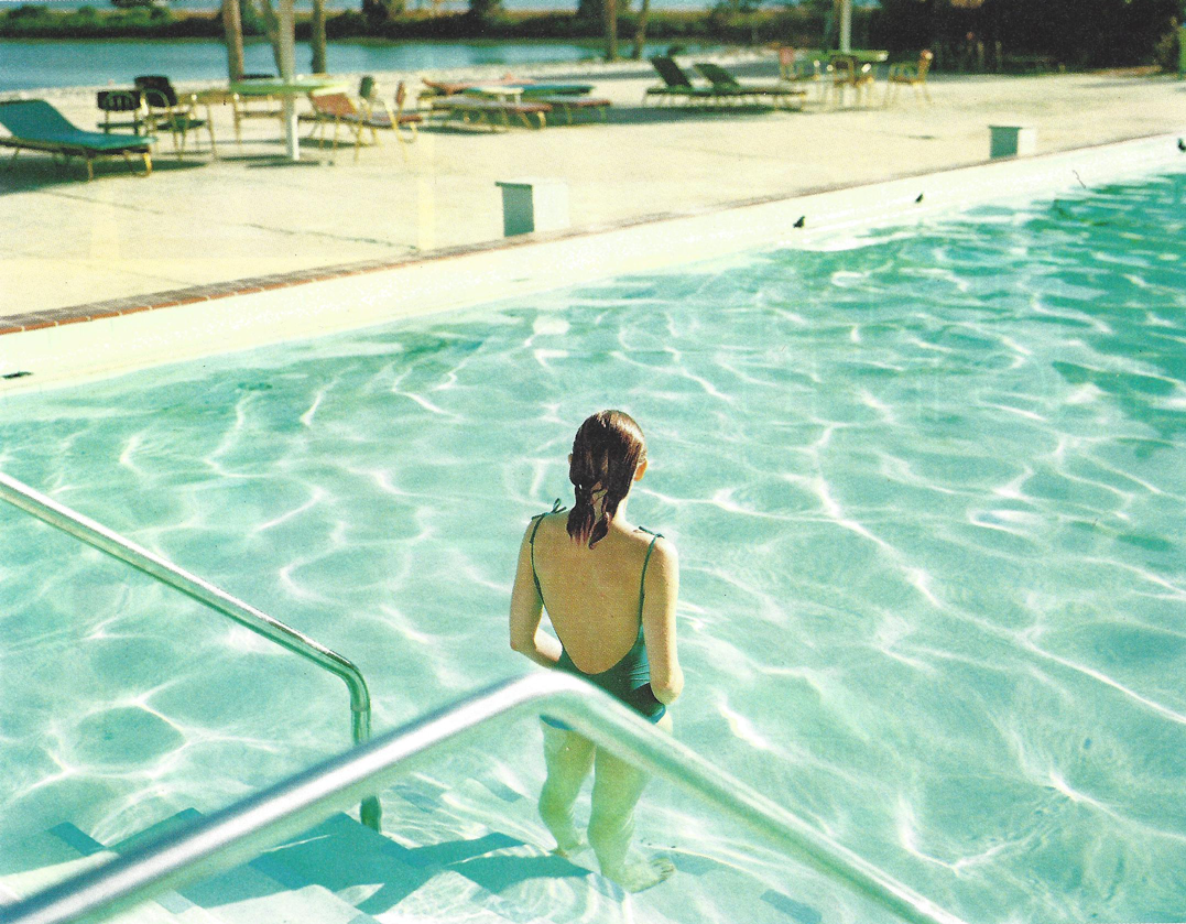 woman standing in pool